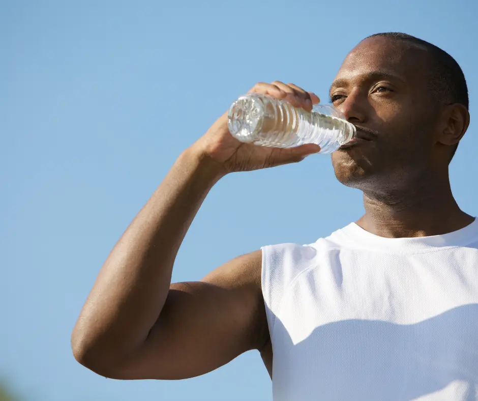 Man drinking bottle of water